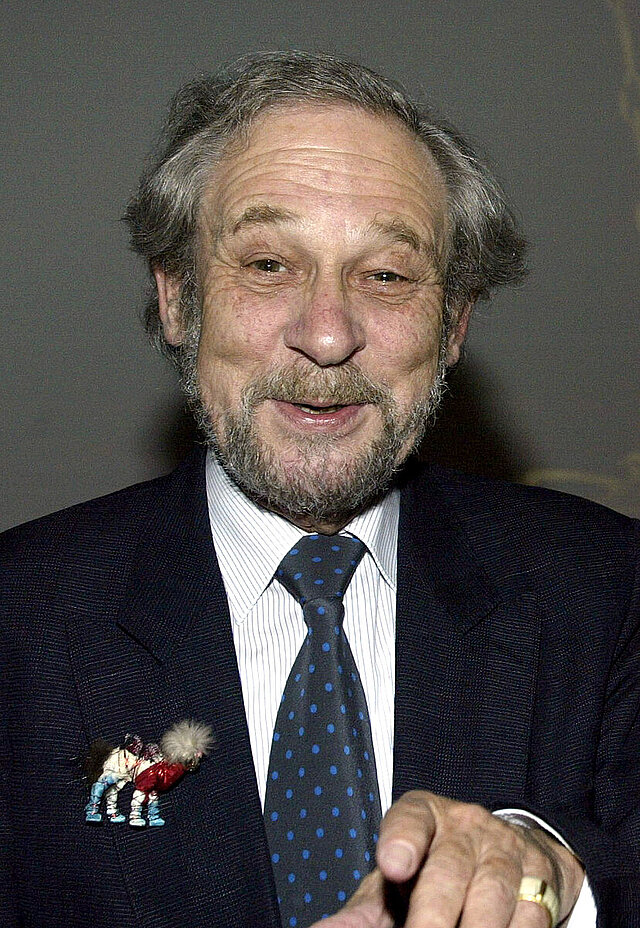 Fritz Falk wearing a camel brooch